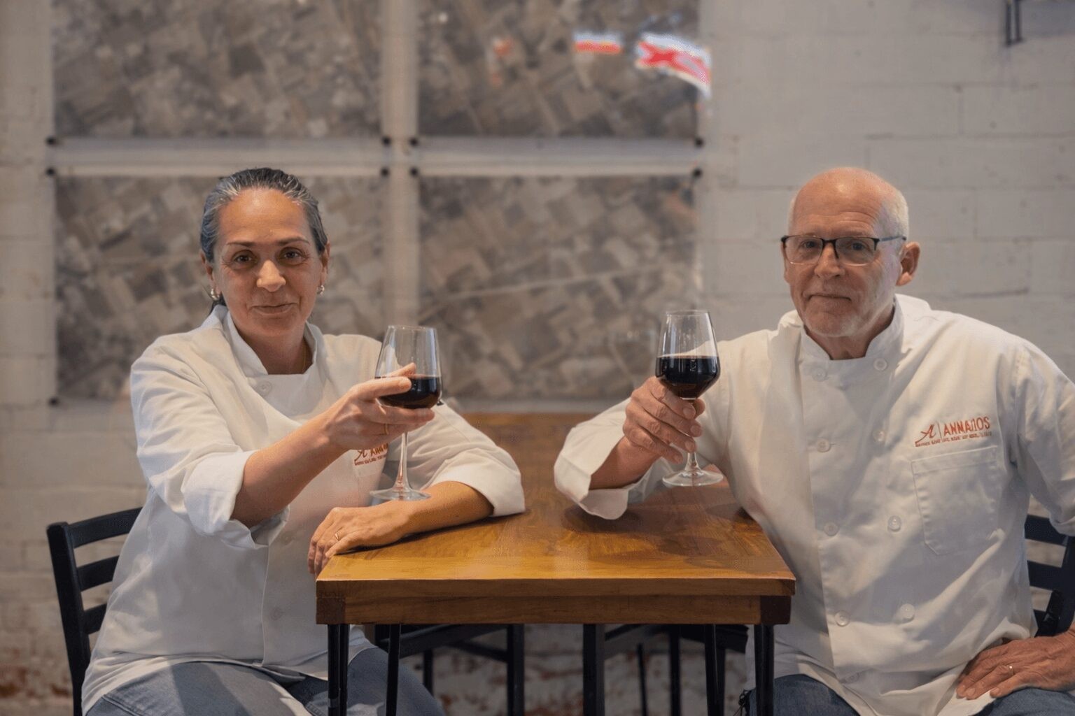 Bill and Doreen Hager of Annagio’s sharing a toast in chef jackets